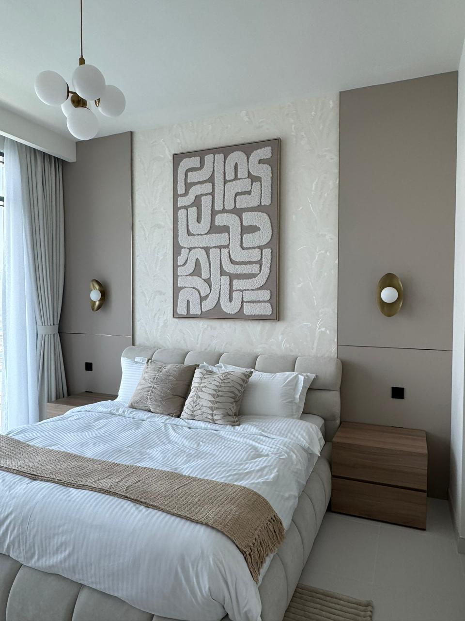 Serene Bedroom Retreat - Tranquil sanctuary featuring textured wall art, statement bubble lighting, and warm neutral tones featuring Japandi style interior design by Aziza Home