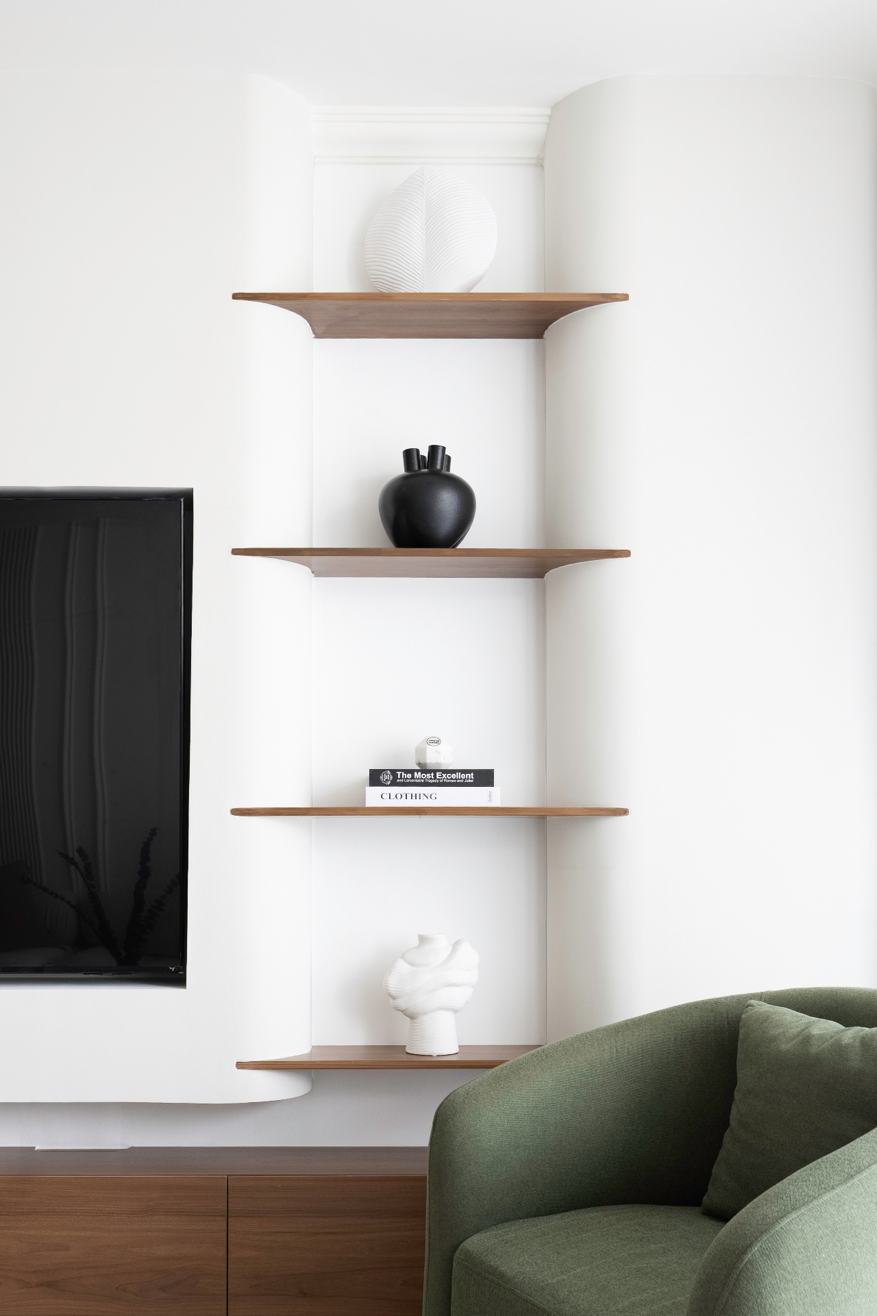 Contemporary TV Media Wall - Modern entertainment center featuring clean paneling and integrated lighting for a refined look featuring Japandi style interior design by Aziza Home